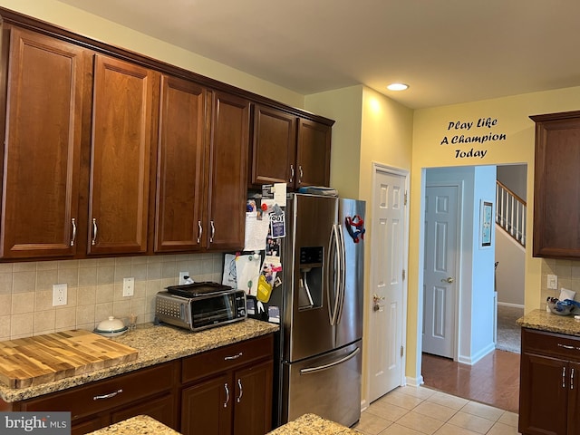 86 Ables Run Dr, Absecon, NJ 08201 - kitchen featuring stainless steel fridge, backsplash, light tile patterned flooring, light stone counters, and dark brown cabinetry