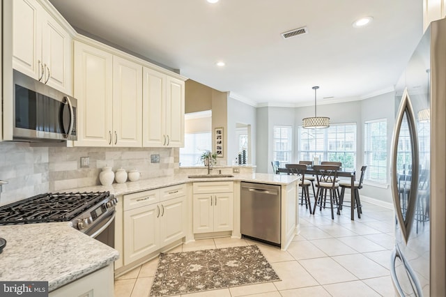 1 Springfield Ave, Berlin, NJ 08009 - kitchen with appliances with stainless steel finishes, decorative backsplash, light tile patterned flooring, recessed lighting, and ornamental molding