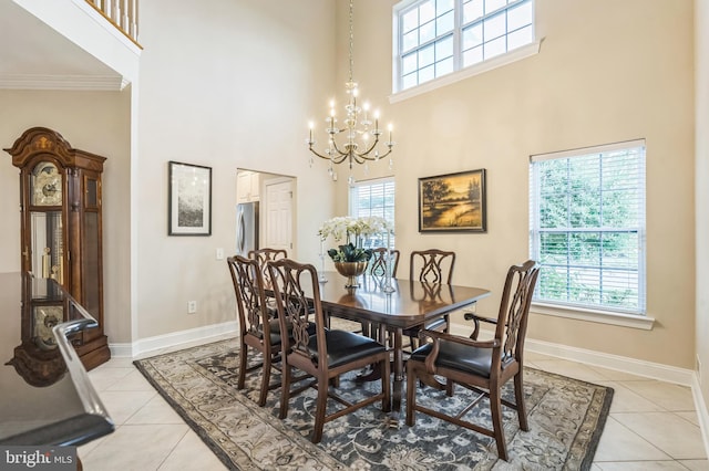 1 Springfield Ave, Berlin, NJ 08009 - dining area featuring a towering ceiling, plenty of natural light, a chandelier, ornamental molding, and light tile patterned flooring