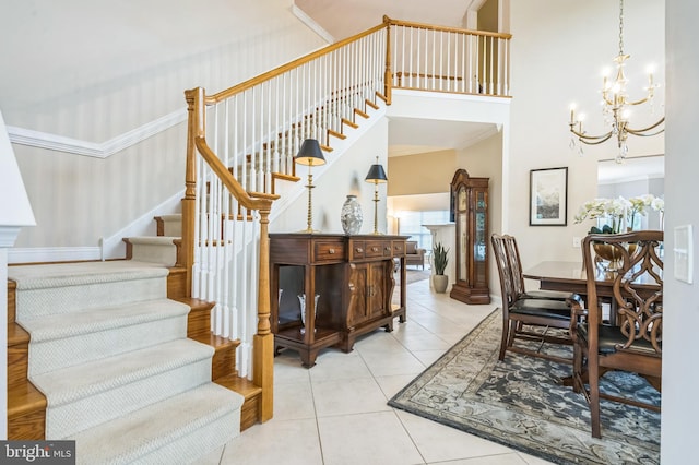 1 Springfield Ave, Berlin, NJ 08009 - stairway with a chandelier, tile patterned flooring, a high ceiling, and ornamental molding