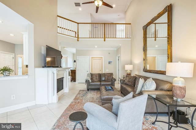 1 Springfield Ave, Berlin, NJ 08009 - living room featuring a towering ceiling, ceiling fan, crown molding, light tile patterned floors, and a fireplace