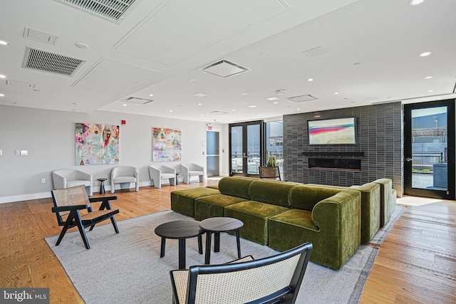 37 L St SE Unit 101, Washington, DC 20003 - living area featuring light wood-type flooring, a large fireplace, and recessed lighting