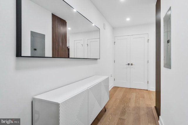 37 L St SE Unit 101, Washington, DC 20003 - hallway with electric panel, light wood-style flooring, and recessed lighting