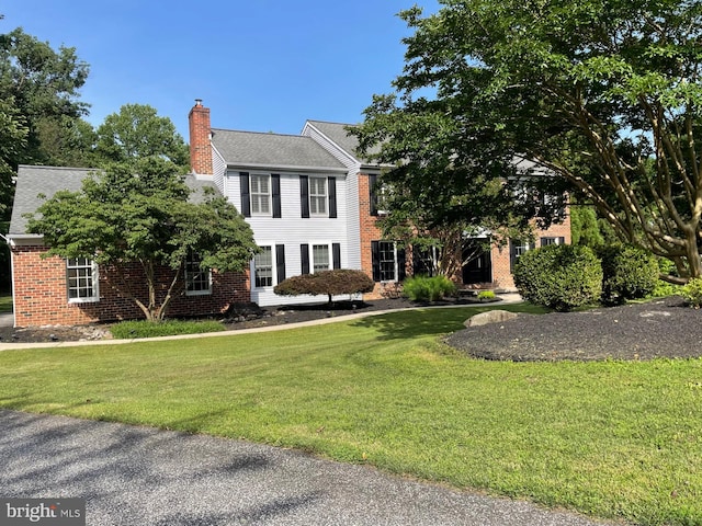11 Georges Way, Glen Mills, PA 19342 - colonial home with a chimney, a front lawn, and brick siding