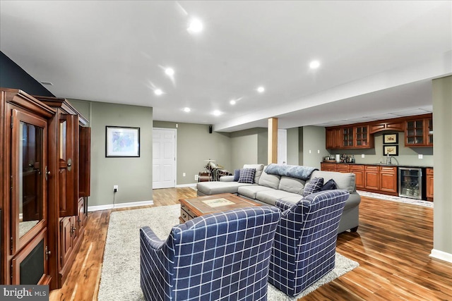 11 Georges Way, Glen Mills, PA 19342 - living room with beverage cooler, bar with sink, light wood-style floors, and recessed lighting