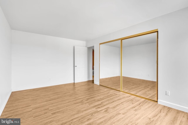 3100 S Manchester St Unit 827, Falls Church, VA 22044 - unfurnished bedroom with wood finished floors and a closet