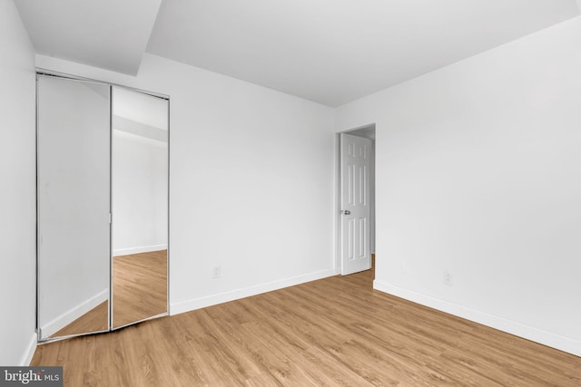 3100 S Manchester St Unit 827, Falls Church, VA 22044 - unfurnished bedroom with wood finished floors and a closet