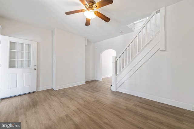 5820 Alter St, Philadelphia, PA 19143 - foyer entrance with arched walkways, stairs, and wood finished floors