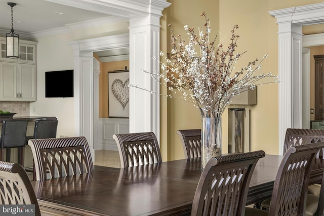 1315 Canal Rd, Princeton, NJ 08540 - dining area with ornate columns, a decorative wall, ornamental molding, a wainscoted wall, and tile patterned floors
