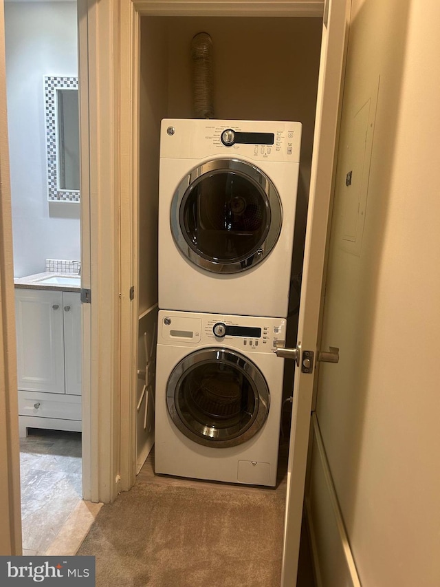 3709 Grant Pl NE Unit A, Washington, DC 20019 - washroom with stacked washer / dryer and carpet
