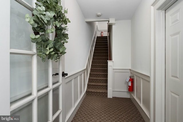 46 Park Pl Unit 3, Princeton, NJ 08542 - staircase featuring a wainscoted wall, carpet floors, and a decorative wall