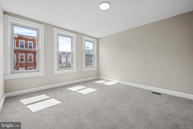 2011 Boone St, Baltimore, MD 21218 - carpeted empty room featuring baseboards