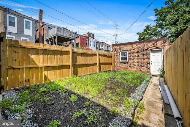 2011 Boone St, Baltimore, MD 21218 - fenced backyard with a residential view and an outbuilding
