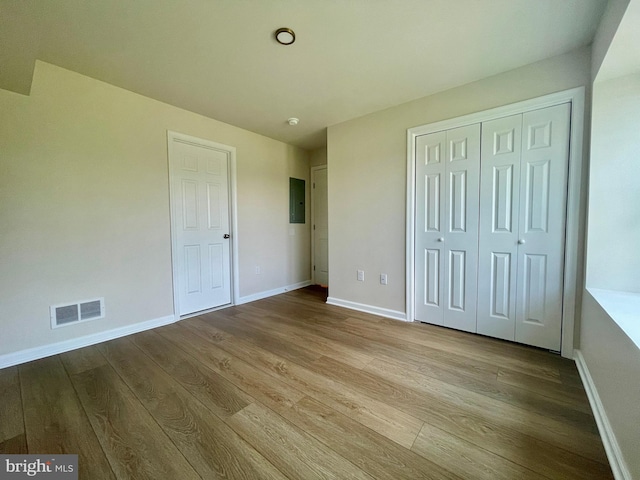 101 Lexington Way, Morgantown, PA 19543 - unfurnished bedroom with wood finished floors, a closet, and electric panel