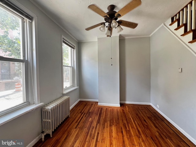 453 Belgrade St, Philadelphia, PA 19125 - empty room featuring radiator, ornamental molding, wood finished floors, and ceiling fan
