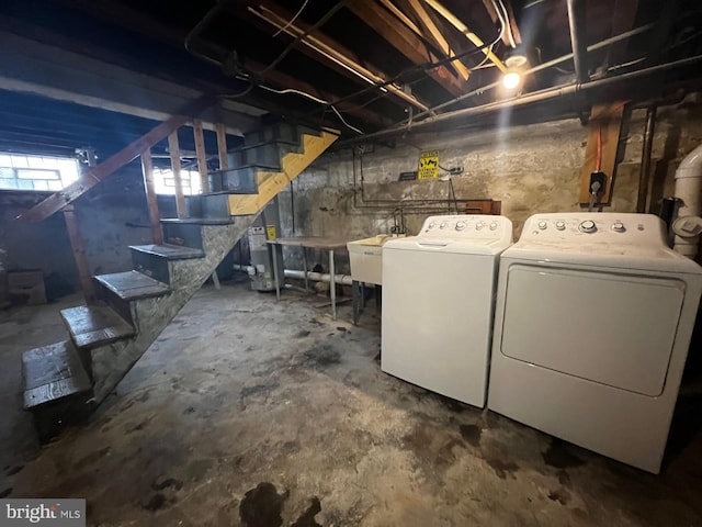 453 Belgrade St, Philadelphia, PA 19125 - basement featuring washer and dryer, stairway, and gas water heater
