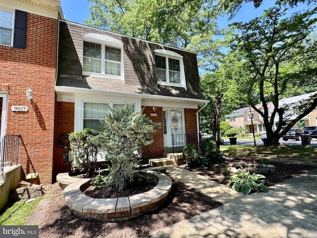 9019 Fox Grape Ln, Springfield, VA 22152 - view of front of property featuring mansard roof, a shingled roof, and brick siding