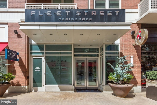 157 Fleet St Unit 303, National Harbor, MD 20745 - view of exterior entry featuring brick siding and french doors