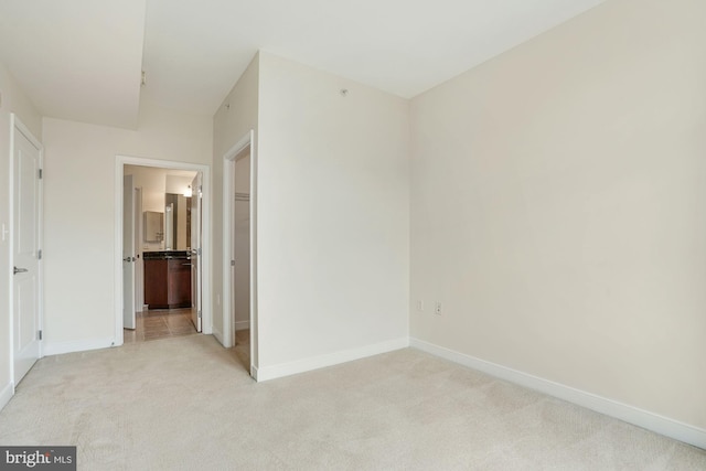 157 Fleet St Unit 303, National Harbor, MD 20745 - unfurnished bedroom with light carpet and ensuite bath