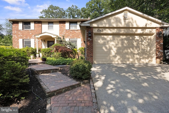 1013 Swallow Dr, Cherry Hill, NJ 08003 - view of front of property featuring brick siding, a garage, and concrete driveway