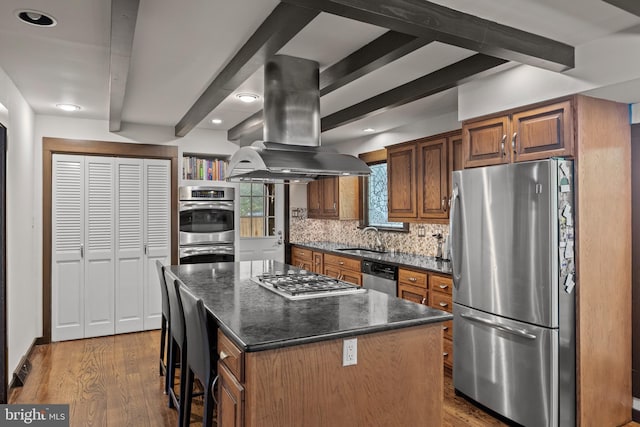 1013 Swallow Dr, Cherry Hill, NJ 08003 - kitchen with appliances with stainless steel finishes, island exhaust hood, tasteful backsplash, beam ceiling, and wood finished floors