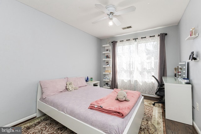 8226 Bates Rd, Lorton, VA 22079 - bedroom with wood finished floors, ceiling fan, and an office area