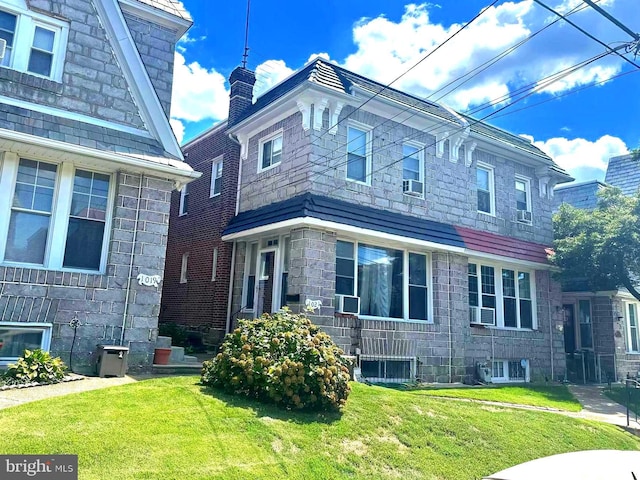 1021 Serrill Ave, Lansdowne, PA 19050 - view of home's exterior with a yard, cooling unit, and stone siding