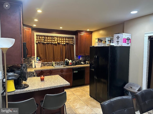1021 Serrill Ave, Lansdowne, PA 19050 - kitchen featuring black appliances, light tile patterned floors, recessed lighting, and tasteful backsplash