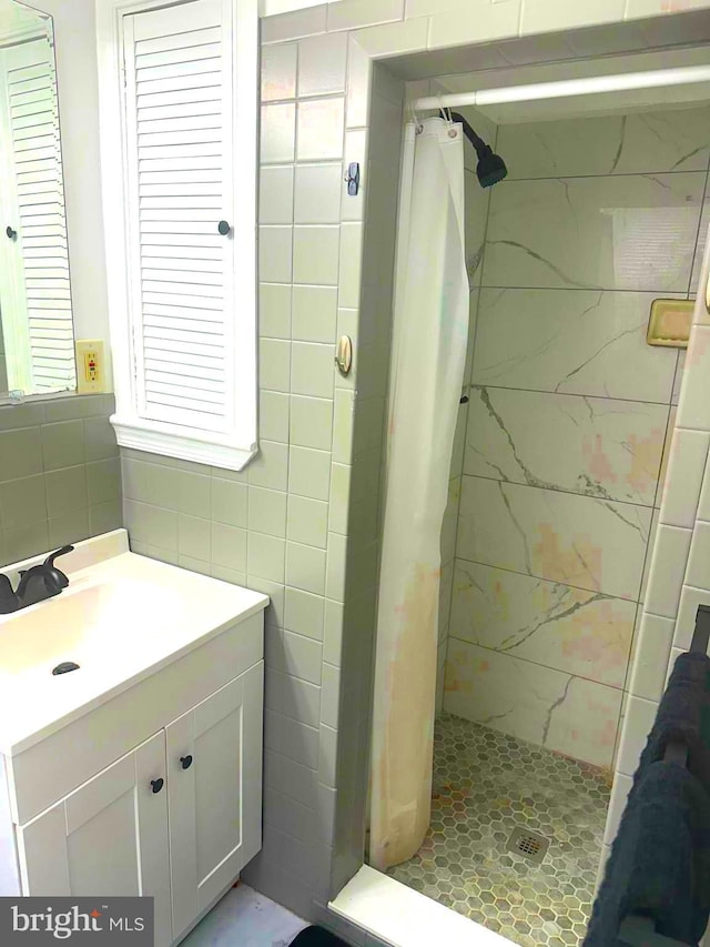 1021 Serrill Ave, Lansdowne, PA 19050 - full bathroom featuring tile walls, a shower stall, and vanity