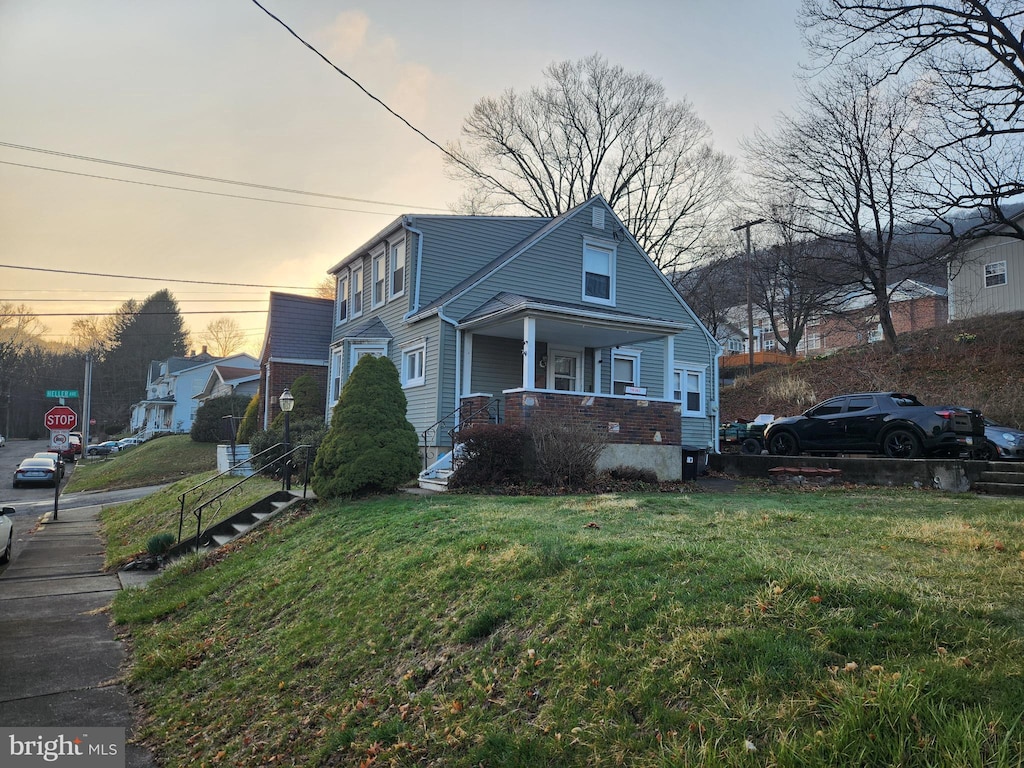 315 W Mountain Ave, Pen Argyl, PA 18072 - view of front facade featuring a porch and a front yard