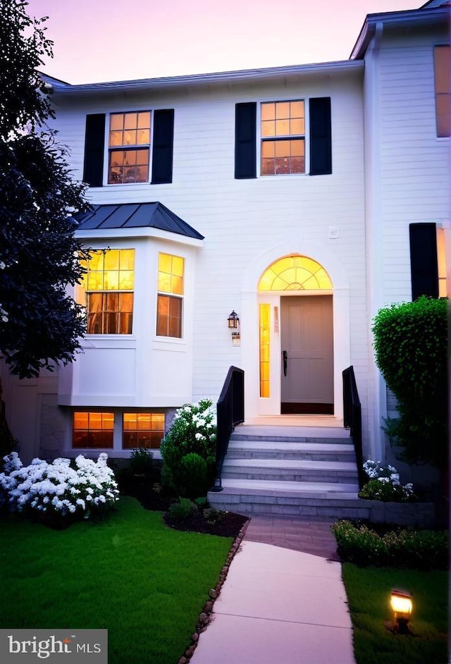4407 Stanford Ct, Owings Mills, MD 21117 - view of front facade featuring a standing seam roof, a metal roof, and a yard