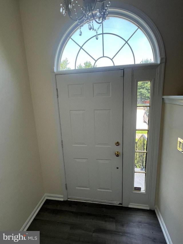 4407 Stanford Ct, Owings Mills, MD 21117 - foyer entrance featuring a chandelier and dark wood-style floors