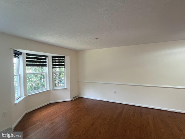 4407 Stanford Ct, Owings Mills, MD 21117 - empty room featuring wood finished floors and a textured ceiling