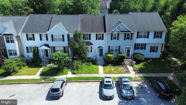 4407 Stanford Ct, Owings Mills, MD 21117 - townhome / multi-family property featuring uncovered parking and a front lawn
