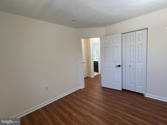 4407 Stanford Ct, Owings Mills, MD 21117 - unfurnished bedroom with dark wood finished floors and a closet