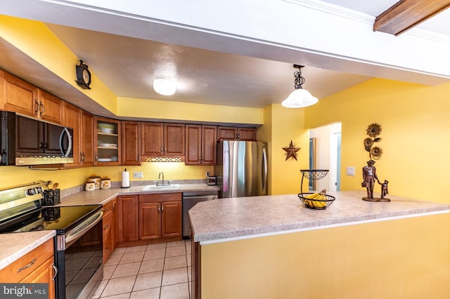 118 Roboda Blvd, Royersford, PA 19468 - kitchen featuring stainless steel appliances, light countertops, light tile patterned flooring, pendant lighting, and brown cabinets