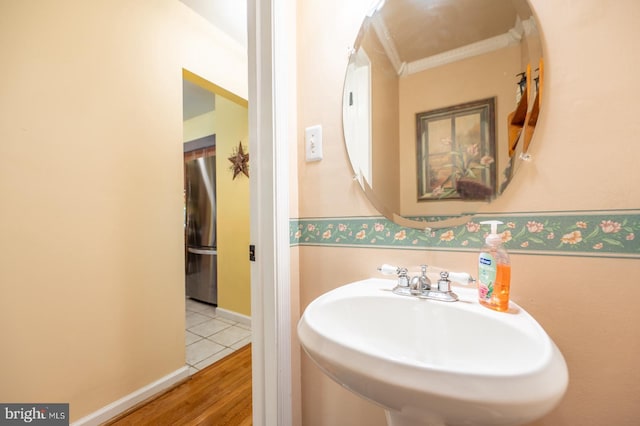 118 Roboda Blvd, Royersford, PA 19468 - bathroom featuring wood finished floors and ornamental molding