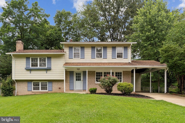13106 Collingwood Ter, Silver Spring, MD 20904 - tri-level home featuring concrete driveway, a front lawn, a chimney, an attached carport, and brick siding
