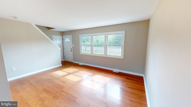 1412 Glassboro Rd, Wenonah, NJ 08090 - unfurnished room featuring light wood finished floors, stairs, and a smoke detector