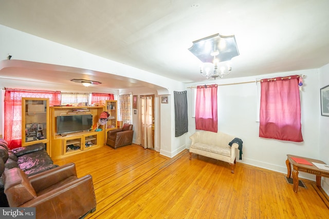 231 N Penn St, West Chester, PA 19380 - living room featuring hardwood / wood-style floors and arched walkways