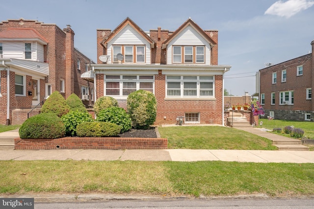231 N Penn St, West Chester, PA 19380 - view of front of home featuring brick siding, a chimney, and a front lawn