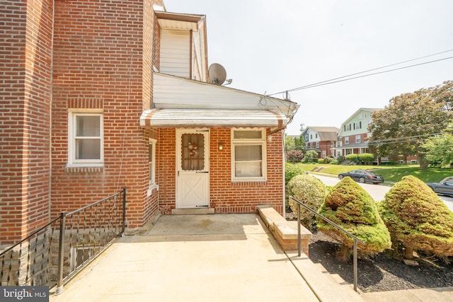 231 N Penn St, West Chester, PA 19380 - doorway to property featuring brick siding