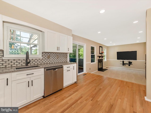 24129 Pecan Grove Ln, Gaithersburg, MD 20882 - kitchen with dishwasher, a fireplace with flush hearth, decorative backsplash, white cabinetry, and recessed lighting