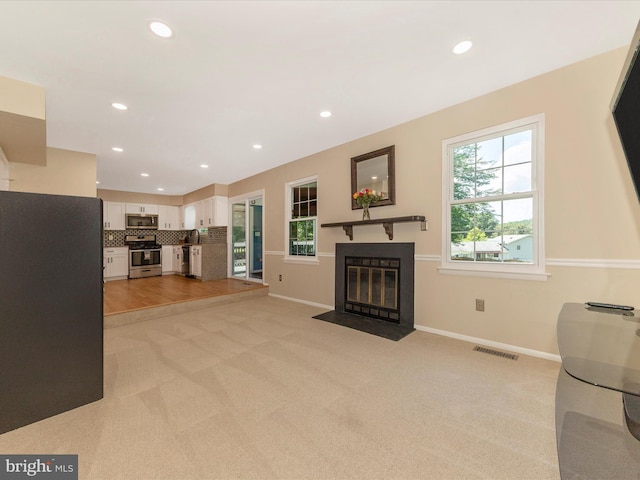 24129 Pecan Grove Ln, Gaithersburg, MD 20882 - living area with a fireplace with flush hearth, light colored carpet, and recessed lighting