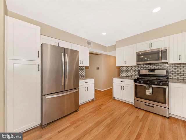 24129 Pecan Grove Ln, Gaithersburg, MD 20882 - kitchen featuring appliances with stainless steel finishes, white cabinetry, decorative backsplash, light wood-style floors, and recessed lighting