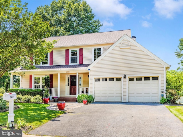24129 Pecan Grove Ln, Gaithersburg, MD 20882 - traditional home with asphalt driveway, an attached garage, a porch, and a front yard