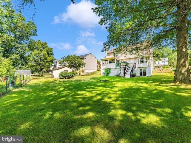 24129 Pecan Grove Ln, Gaithersburg, MD 20882 - fenced backyard featuring stairs, an outdoor structure, and a deck