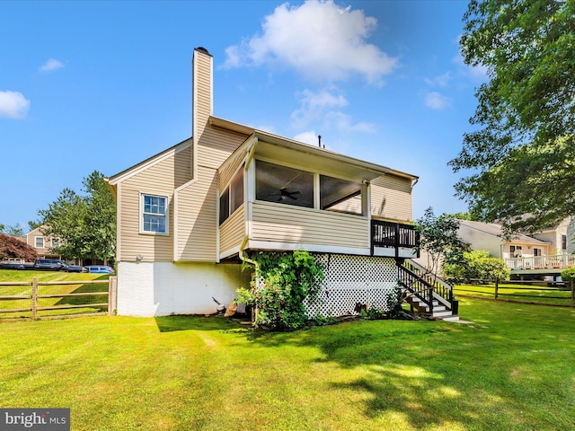24129 Pecan Grove Ln, Gaithersburg, MD 20882 - rear view of house with ceiling fan, stairs, a chimney, and a sunroom