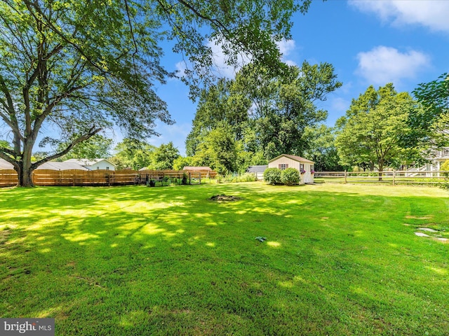 24129 Pecan Grove Ln, Gaithersburg, MD 20882 - fenced backyard featuring a storage unit