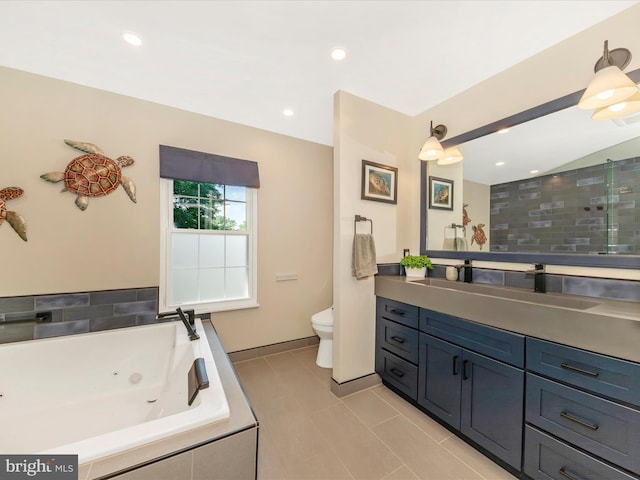 24129 Pecan Grove Ln, Gaithersburg, MD 20882 - bathroom featuring a tub with jets, vanity, recessed lighting, and tile patterned flooring
